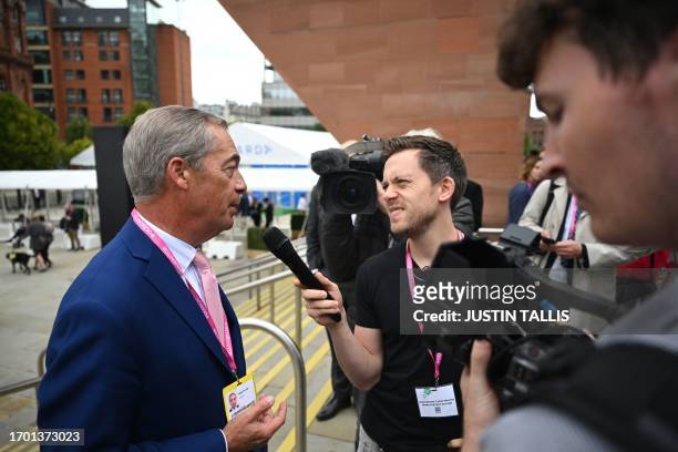 Nigel Farage , former leader of the Brexit Party and the anti-immigration party UKIP, speaks to The Guardian journalist Owen Jones as he arrives to...