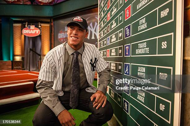 Fresno State University outfielder and 32nd overall selection Aaron Judge poses next to the Draft board during the 2013 First-Year Player Draft at...