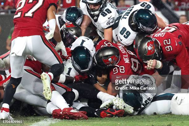Jalen Hurts of the Philadelphia Eagles rushes for a touchdown during the third quarter against the Tampa Bay Buccaneers at Raymond James Stadium on...