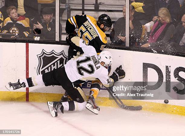 Jarome Iginla of the Pittsburgh Penguins and Johnny Boychuk of the Boston Bruins collide along the boards in the second period in Game Four of the...