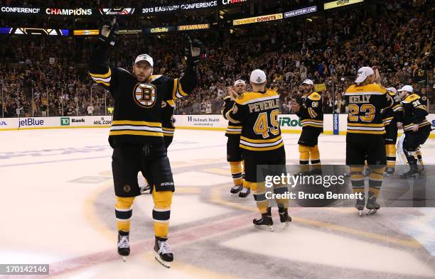 Milan Lucic of the Boston Bruins celebrates with teammates after defeating the Pittsburgh Penguins 1-0 in Game Four of the Eastern Conference Final...