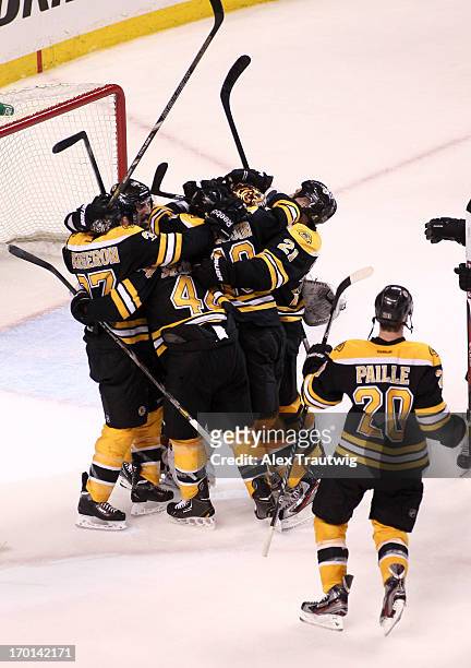 Brad Marchand of the Boston Bruins celebrates with teammates after defeating the Pittsburgh Penguins 1-0 in Game Four of the Eastern Conference Final...