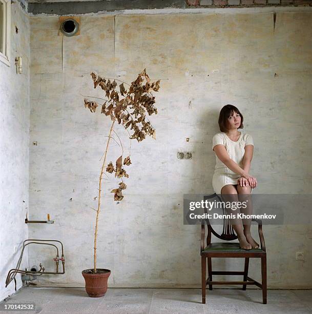 girl standing on a chair - osteuropäischer abstammung stock-fotos und bilder