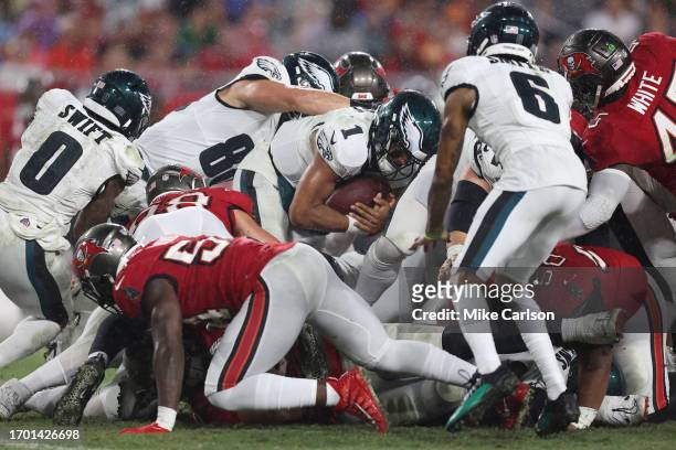 Jalen Hurts of the Philadelphia Eagles quarterback sneak for a first down during the third quarter against the Tampa Bay Buccaneers at Raymond James...