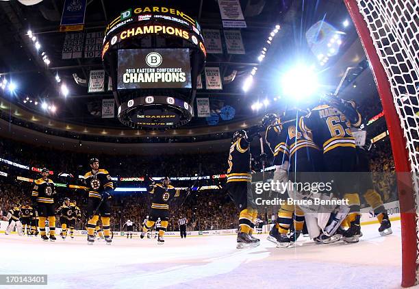 Dennis Seidenberg and Tuukka Rask of the Boston Bruins celebrate with teammates after defeating the Pittsburgh Penguins 1-0 in Game Four of the...