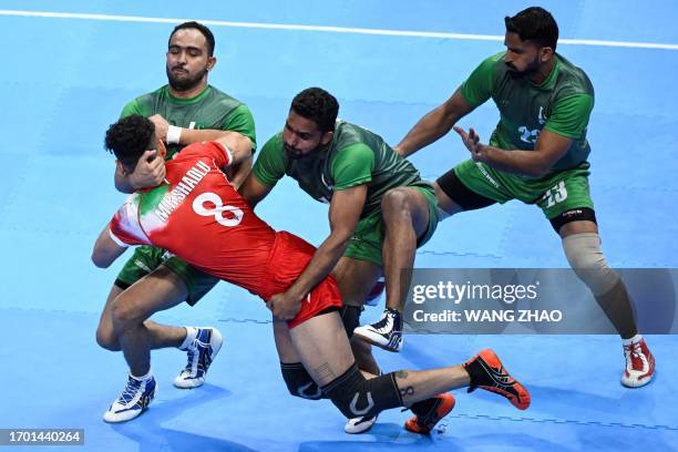 Iran's Mohammadreza Shadlouichiyaneh competes in the man's team group Kabaddi event against Pakistan during the Hangzhou 2022 Asian Games in...