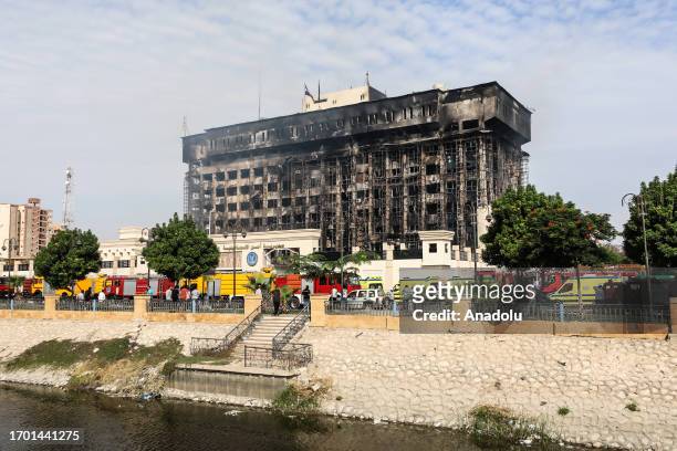 Firefighters continue extinguishing and cooling works after a fire that broke out in the police facility in Egypt's northeastern Ismailia city, Egypt...