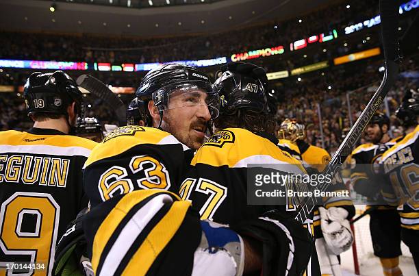 Brad Marchand hugs Torey Krug of the Boston Bruins after defeating the Pittsburgh Penguins 1-0 in Game Four of the Eastern Conference Final during...