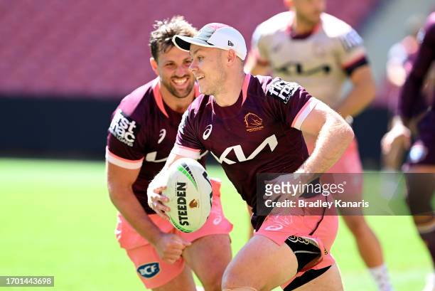 Billy Walters breaks away from the defence of team mate Tyson Smoothy during a Brisbane Broncos NRL training session at Suncorp Stadium on September...