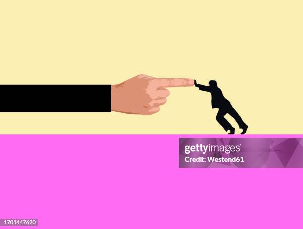 stockillustraties, clipart, cartoons en iconen met silhouette of man pushing against oversized hand - wijsvinger