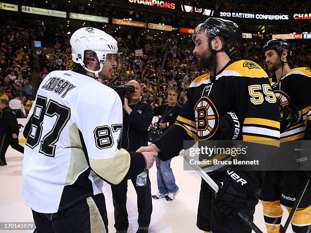 Sidney Crosby of the Pittsburgh Penguins shakes hands with Johnny Boychuk of the Boston Bruins after the Bruins defeated the Penguins 1-0 in Game...
