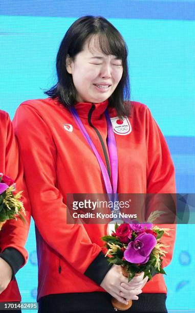 Japan goalkeeper Minami Shioya fights back tears during the awards ceremony after losing to China in their final women's water polo round-robin match...