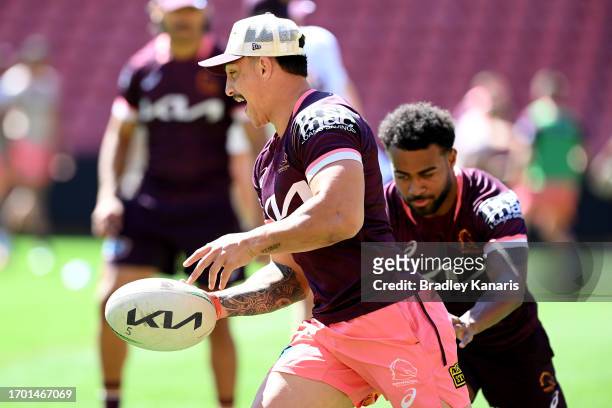 Kotoni Staggs breaks away from the defence of Ezra Mam during a Brisbane Broncos NRL training session at Suncorp Stadium on September 26, 2023 in...