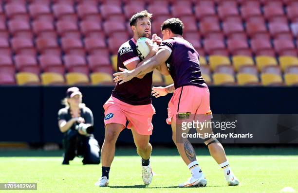 Tyson Smoothy takes on the defence during a Brisbane Broncos NRL training session at Suncorp Stadium on September 26, 2023 in Brisbane, Australia.