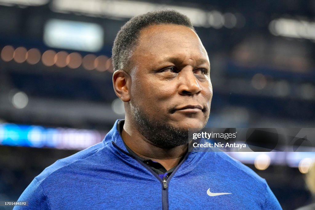 Former Detroit Lions player Barry Sanders looks on before the game