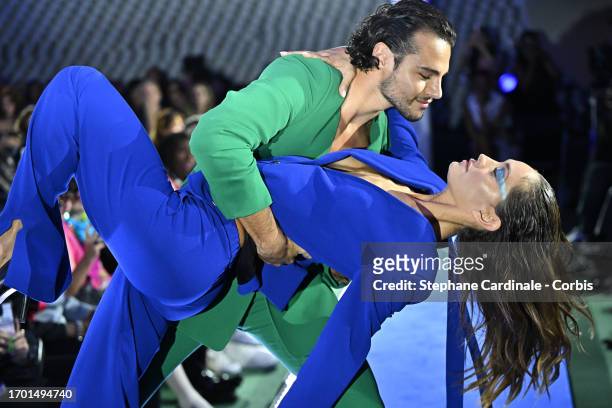 Dancer Anthony Colette and a model walk the runway during the Pierre Cardin Womenswear Spring/Summer 2024 show as part of Paris Fashion Week on...