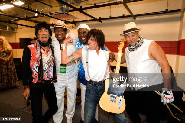 From left, musicians Ron Wood, unidentified, Buddy Guy, Jeff Beck, and Narada Michael Walden pose backstage at Eric Clapton's Crossroads Guitar...