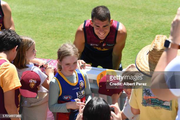 Brandon Starcevich of the Lions greets fans during a Brisbane Lions AFL training session at Brighton Homes Arena on September 26, 2023 in Ipswich,...