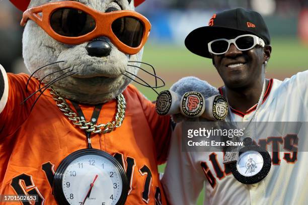 Rapper Flavor Flav poses with San Francisco Giants mascot Lou Seal before their game against the San Diego Padres at Oracle Park on September 25,...