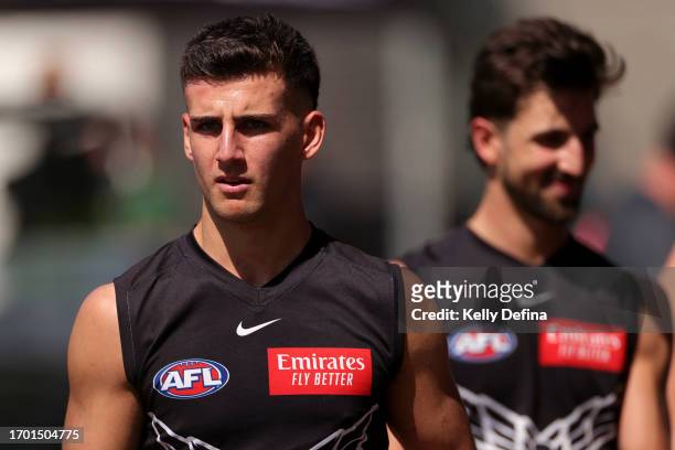Nick Daicos of the Magpies looks on with Josh Daicos of the Magpies during a Collingwood Magpies AFL training session at AIA Centre on September 26,...