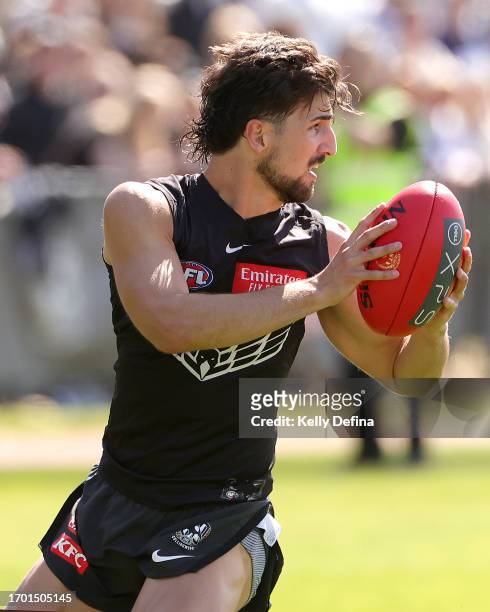 Josh Daicos of the Magpies marks the ball during a Collingwood Magpies AFL training session at AIA Centre on September 26, 2023 in Melbourne,...