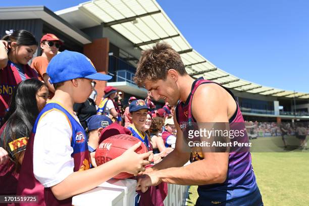 Zac Bailey of the Lions signs autographs during a Brisbane Lions AFL training session at Brighton Homes Arena on September 26, 2023 in Ipswich,...
