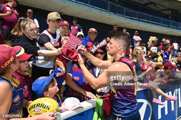 Dayne Zorko of the Lions signs autographs during a Brisbane Lions AFL training session at Brighton Homes Arena on September 26, 2023 in Ipswich,...