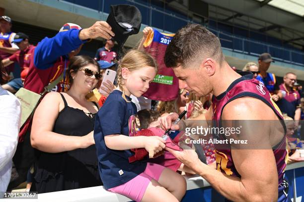 Dayne Zorko of the Lions signs autographs during a Brisbane Lions AFL training session at Brighton Homes Arena on September 26, 2023 in Ipswich,...