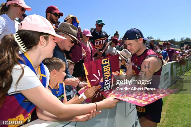 Lachie Neale of the Lions interacts with fans during a Brisbane Lions AFL training session at Brighton Homes Arena on September 26, 2023 in Ipswich,...