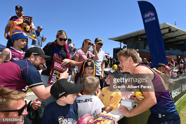 Jaspa Fletcher of the Lions interacts with fans during a Brisbane Lions AFL training session at Brighton Homes Arena on September 26, 2023 in...