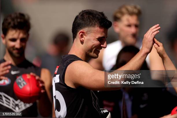 Nick Daicos of the Magpies greets fans during a Collingwood Magpies AFL training session at AIA Centre on September 26, 2023 in Melbourne, Australia.