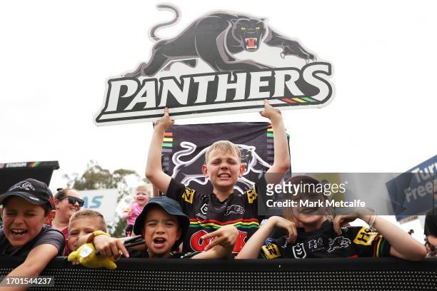 Young Panthers fan watch a Penrith Panthers NRL training session at BlueBet Stadium on September 26, 2023 in Penrith, Australia.