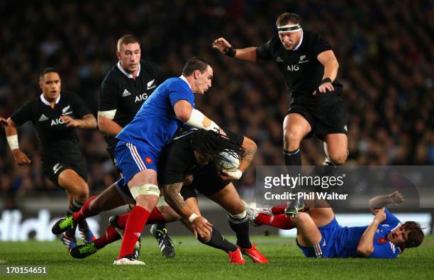 Ma'a Nonu of the All Blacks is tackled by Louis Picamoles of France during the first test match between the New Zealand All Blacks and France at Eden...