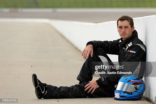 Ben Kennedy, driver of the Emco Gears/Mac Tools/Mechanix Wear Chevrolet poses at Iowa Speedway on June 7, 2013 in Newton, Iowa. Kennedy was selected...