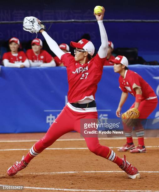 Starting pitcher Miu Goto takes the mound for Japan in the women's softball gold-medal game against China during the Asian Games in Shaoxing, China,...