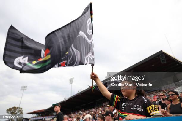 Young Panthers fan watches a Penrith Panthers NRL training session at BlueBet Stadium on September 26, 2023 in Penrith, Australia.