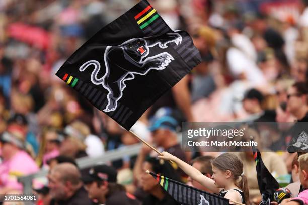 Young Panthers fan watches a Penrith Panthers NRL training session at BlueBet Stadium on September 26, 2023 in Penrith, Australia.
