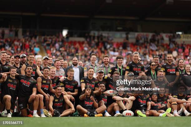 Panthers players and staff pose for a photo in front of fans during a Penrith Panthers NRL training session at BlueBet Stadium on September 26, 2023...