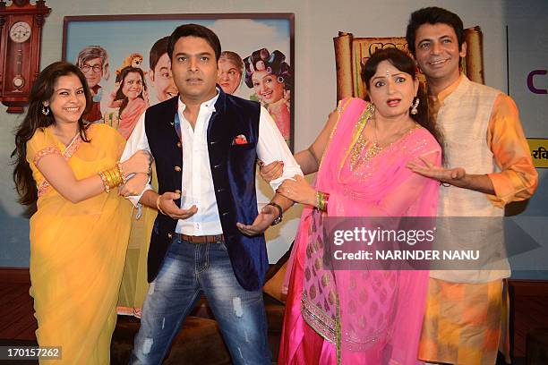 Indian comedy actor Kapil Sharma , Sunil Grover , actresses Upasana Singh , and Sumona Chakravarti pose during a press conference at a hotel in...