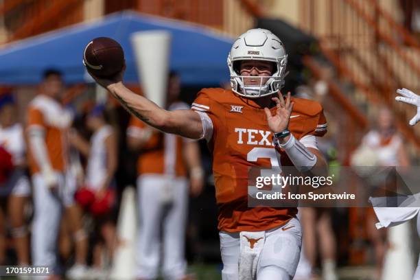 Texas Longhorns quarterback Quinn Ewers throws the ball during the Big 12 football game between Texas Longhorns and Kansas Jayhawks on September 30...