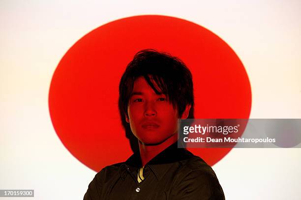 Atsuto Uchida of Japan and club football team Schalke 04 poses during a portrait session at Veltins-Arena on April 25, 2013 in Gelsenkirchen, Germany.