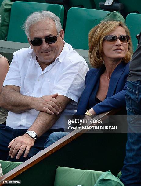 Former IMF chief Dominique Strauss Kahn and his partner Media Marketing Executive Myriam L'Aouffir attend the 2013 French tennis Open women's final...