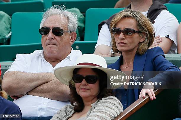 Former IMF chief Dominique Strauss Kahn and his partner Media Marketing Executive Myriam L'Aouffir attend the 2013 French tennis Open women's final...