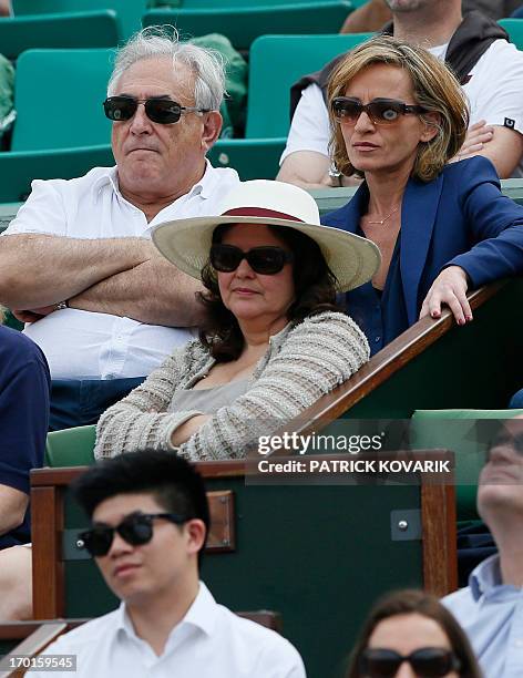 Former IMF chief Dominique Strauss Kahn and his partner Media Marketing Executive Myriam L'Aouffir attend the 2013 French tennis Open women's final...
