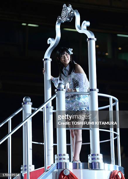 Rino Sashihara of HKT48, one part of Japanese girl pop group AKB48, acknowledges fans after she was selected for the first and centre recording...