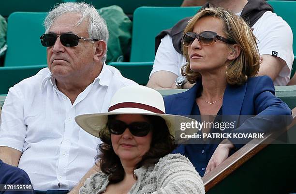 Former IMF chief Dominique Strauss Kahn and his partner Media Marketing Executive Myriam L'Aouffir attend the 2013 French tennis Open women's final...