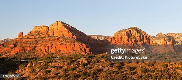 twin buttes at sunset, sedona, arizona - butte rocky outcrop stock pictures, royalty-free photos & images