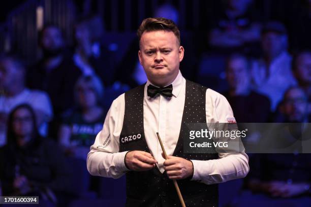 Shaun Murphy of England chalks the cue in the first round match against Rebecca Kenna of England on day one of the 2023 Cazoo British Open at the...