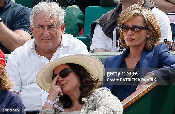 Former IMF chief Dominique Strauss Kahn and his partner Media Marketing Executive Myriam L'Aouffir attend the 2013 French tennis Open women's final...