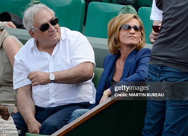 Former IMF chief Dominique Strauss Kahn and his partner Media Marketing Executive Myriam L'Aouffir attend the 2013 French tennis Open women's final...